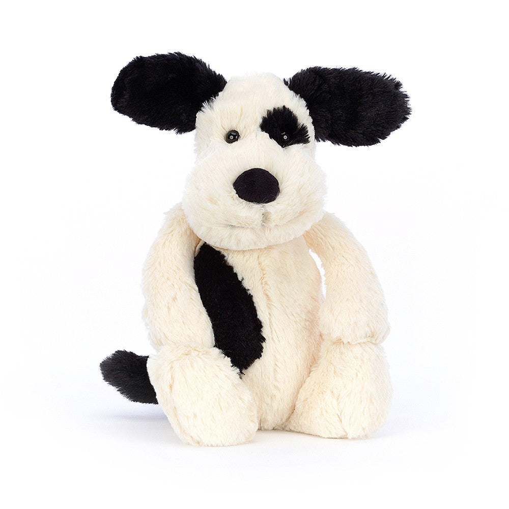 A front photo of the original/medium size  Jellycat Bashful Black and Cream Puppy on a white backround.
