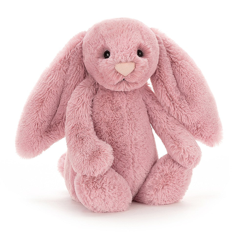 Tulip pink bunny with a gentle expression, sitting upright.