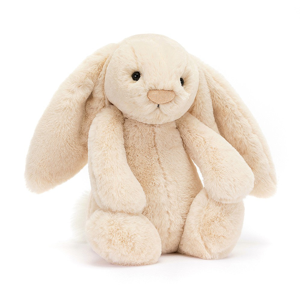 A plush toy resembling a bunny with a beige color, long ears, and a soft fur texture. The bunny has a simple, friendly facial expression with a nose detailed with sparkling thread.