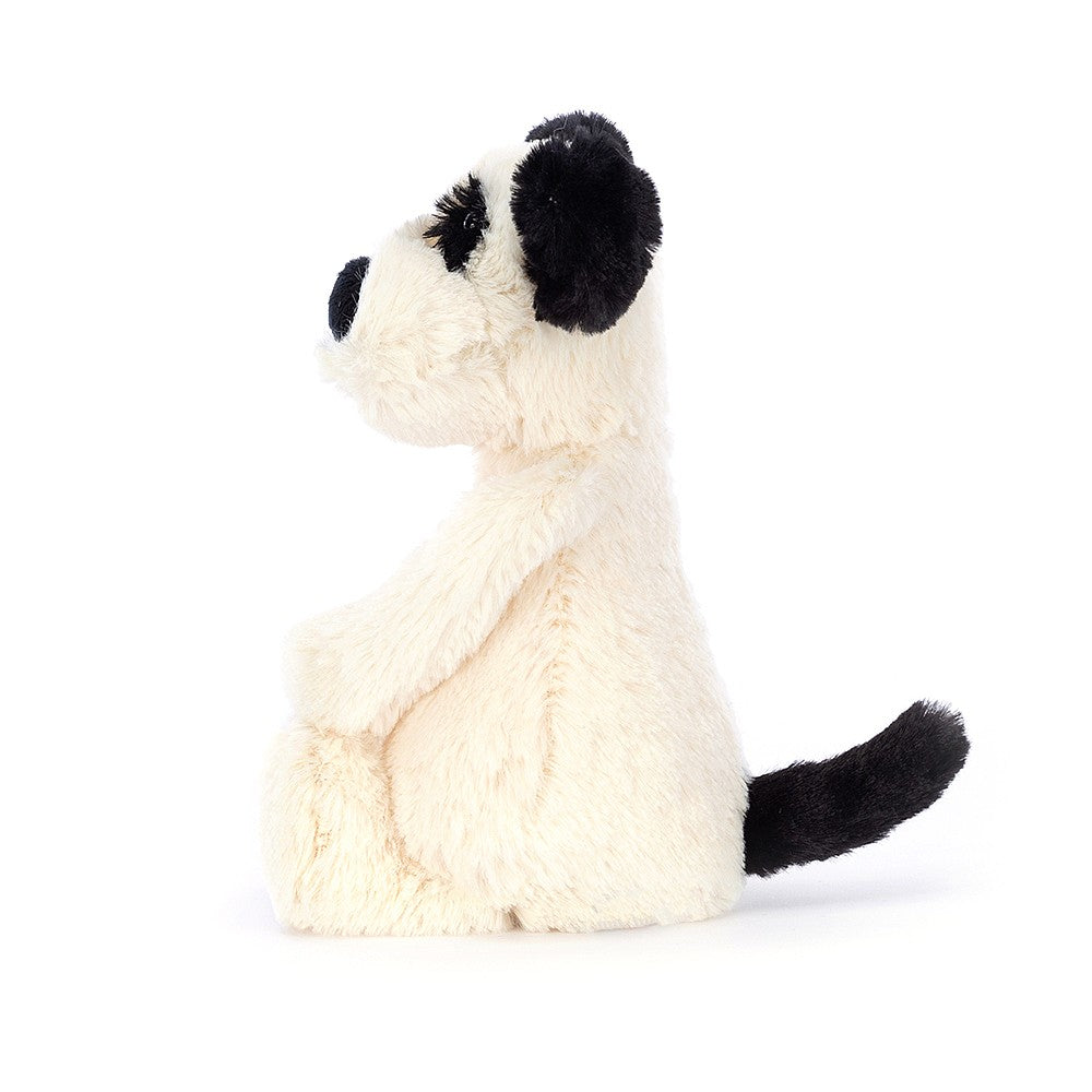 A side photo of the little size  Jellycat Bashful Black and Cream Puppy on a white backround.