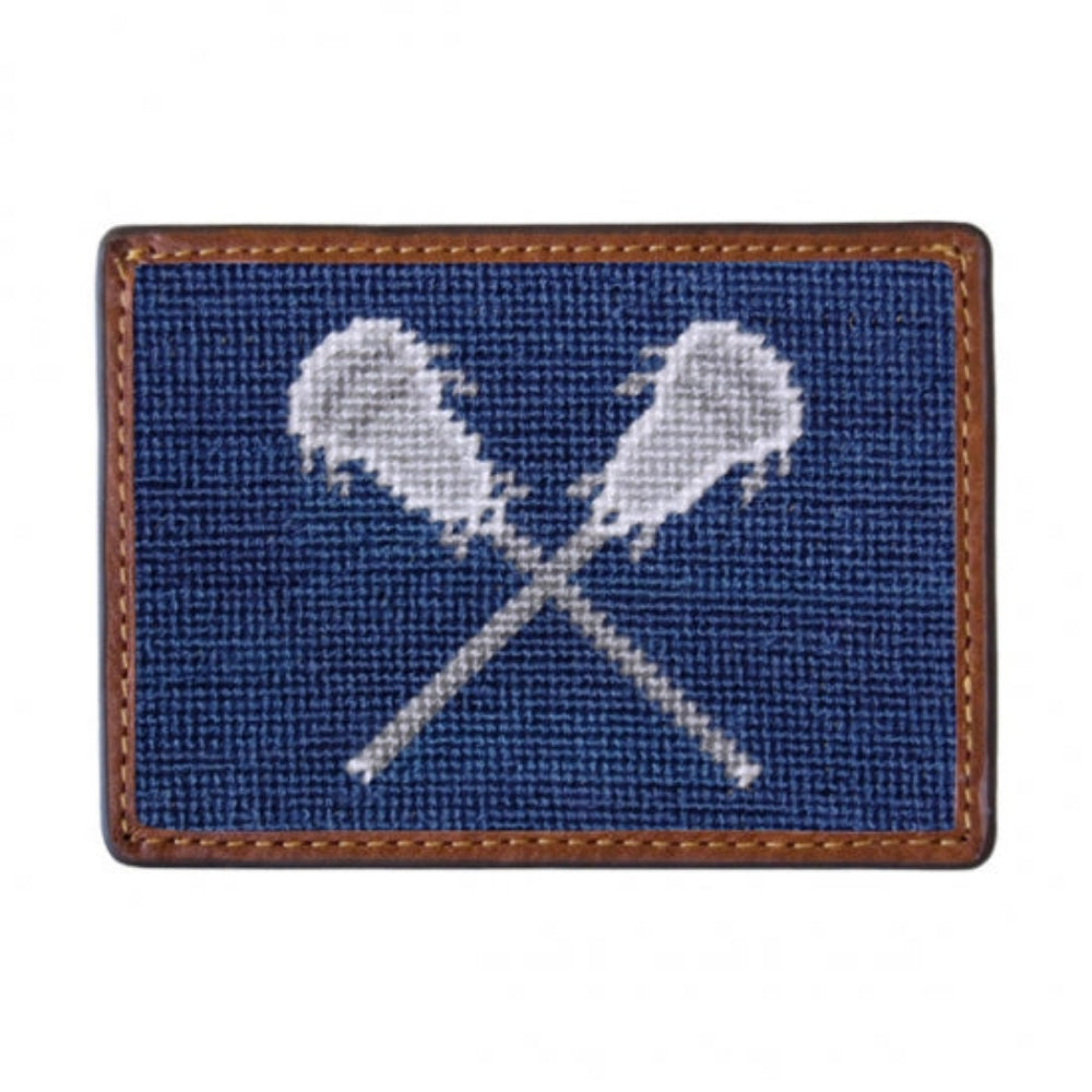 Needlepoint cardholder with lacrosse sticks and balls design on a white background