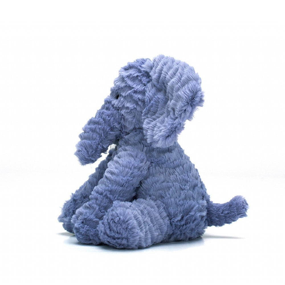 Side of a blue plush elephant toy on a white background
