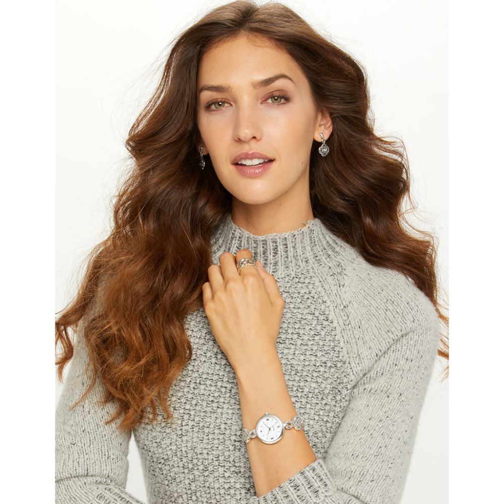 silver earrings on model