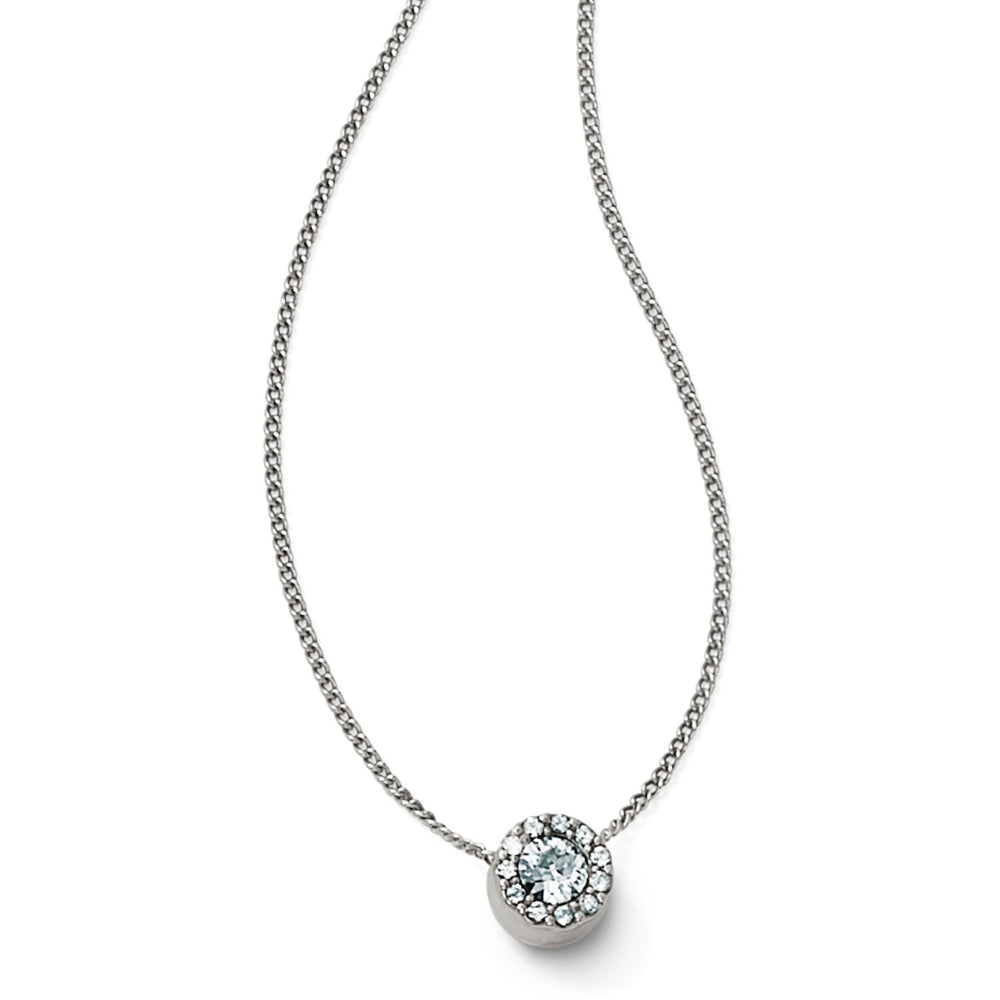 Silver necklace with a round pendant on a white background