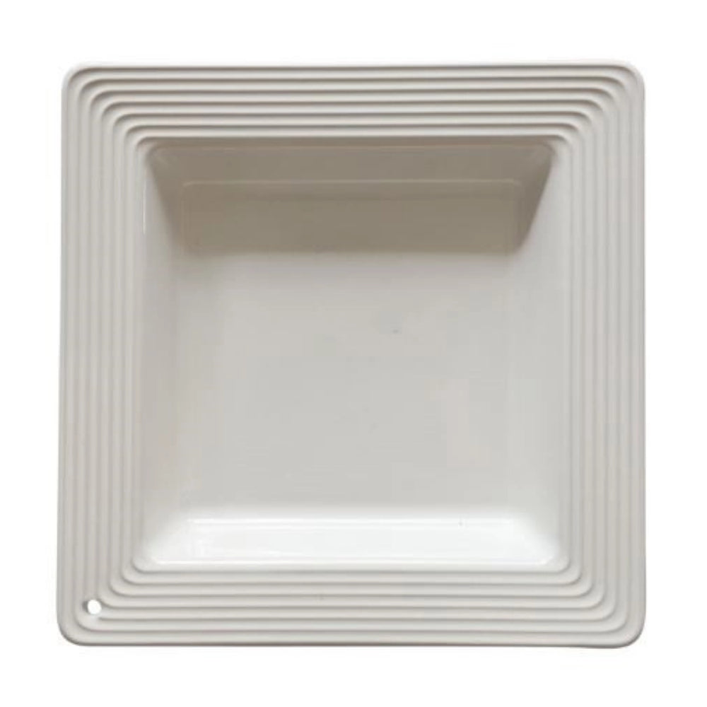 Top of a white square ceramic napkin holder with textured rim on a white background