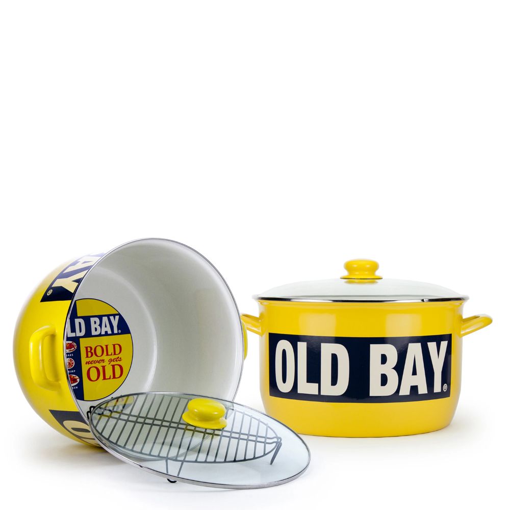 Yellow pot with 'OLD BAY' label on a on its side on a white background.
