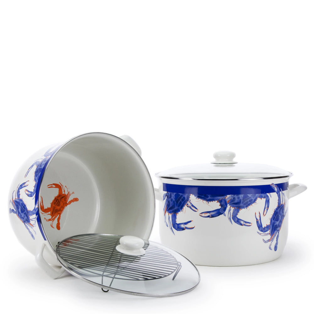 White crab themed enameled steeled stock pot with blue crab designs and a red crab on the inside bottom on a white backround. 