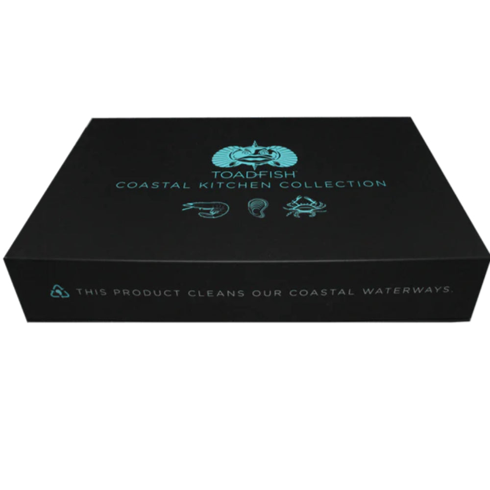 Set of kitchen knives and tools in a opened teal and black box on a white backround. 
