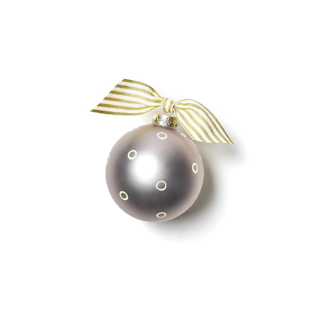 Back of ornament with circle designs, grey color, gold and white accent tied bow on top. 